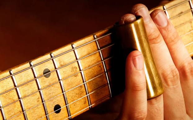 Cómo tocar una cigar box guitar con slide: técnicas y consejos